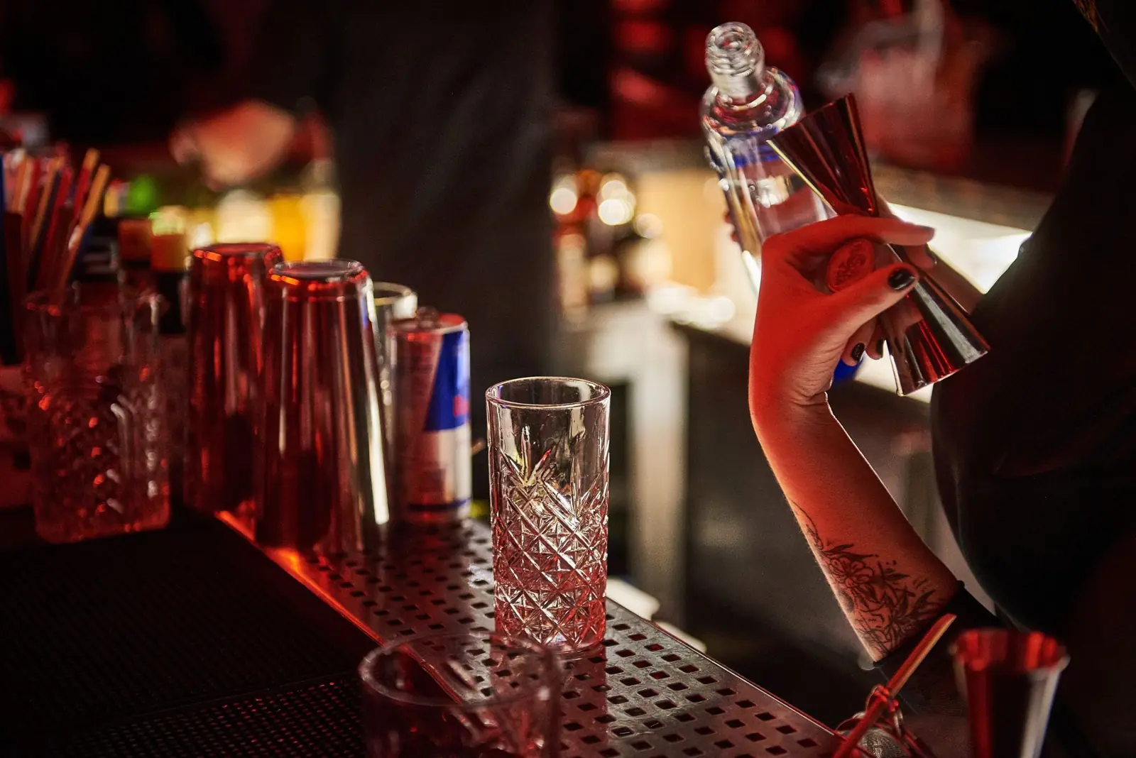 Bartender measuring a pour