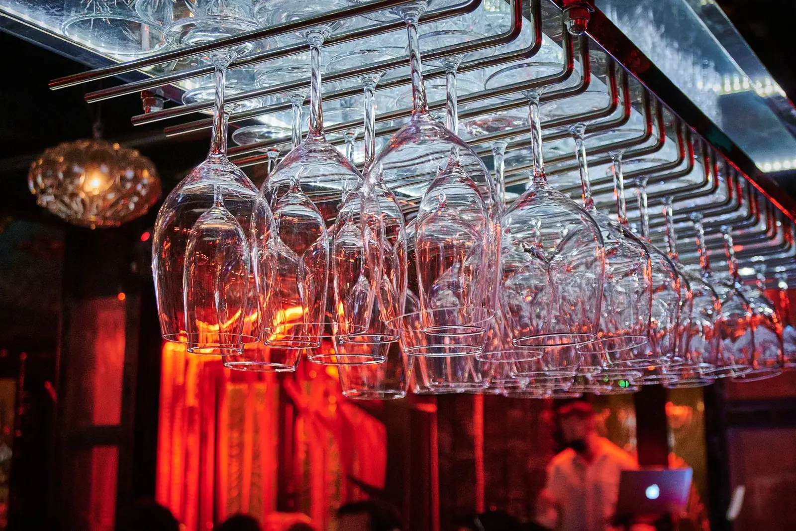 Wine glasses hanging above the bar
