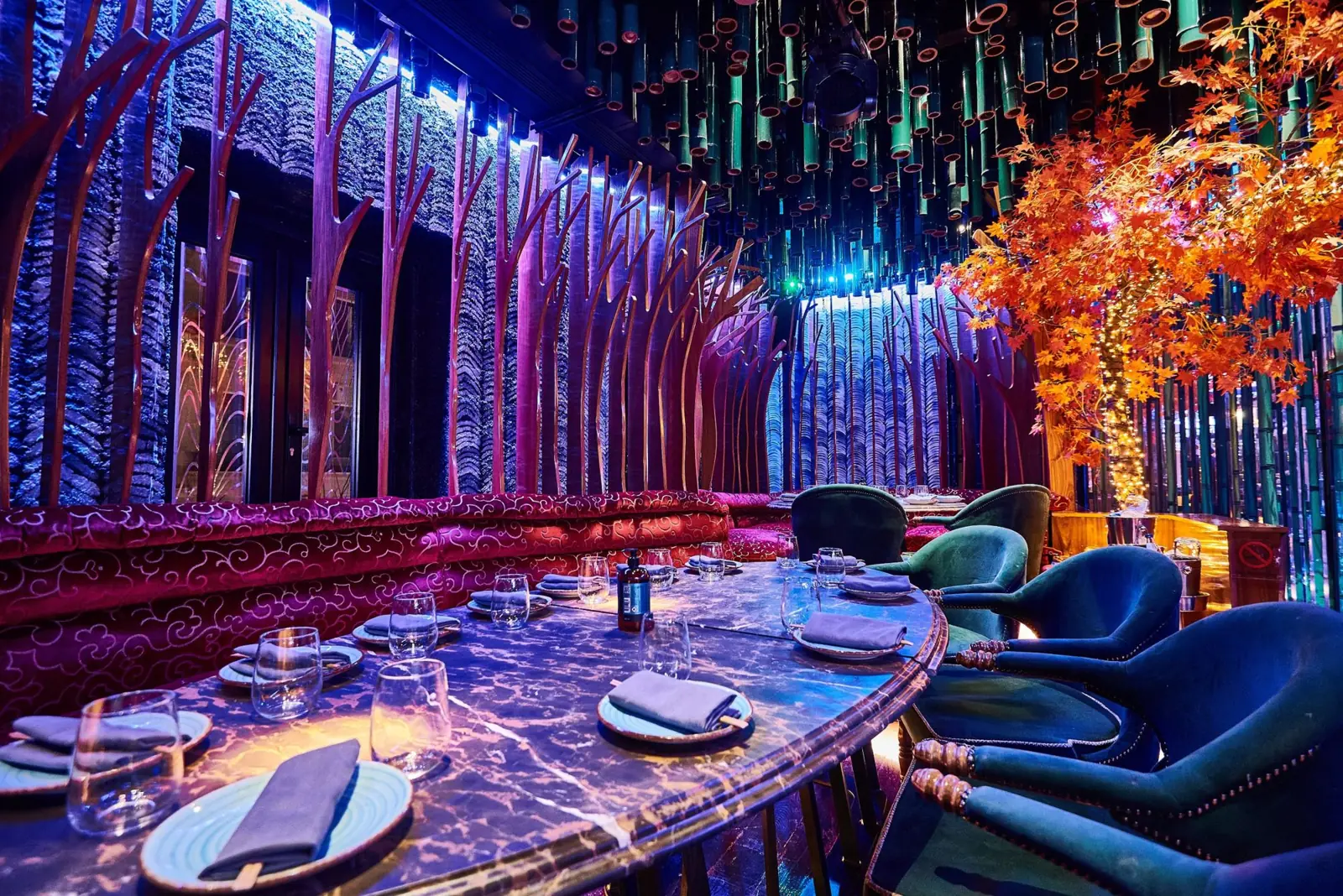 Purple marble table under wooden trees and the bamboo ceiling