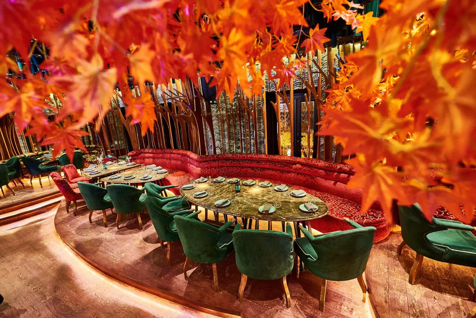 The dining room framed by red maple leaves