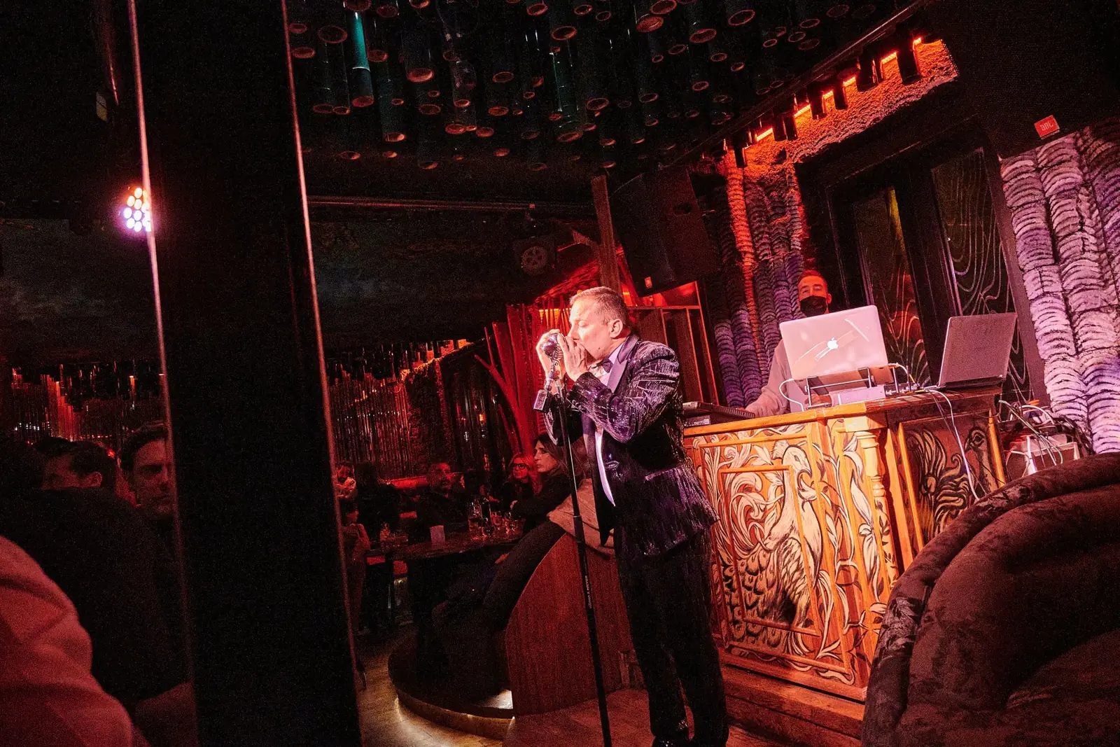 Singer at the vintage microphone beside the DJ